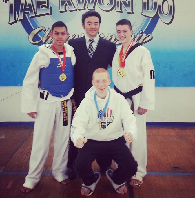 Masters MA students with trophies